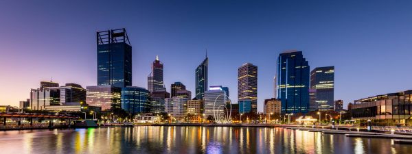 Elizabeth Quay Perth, view of city lit up from Swan river at evening