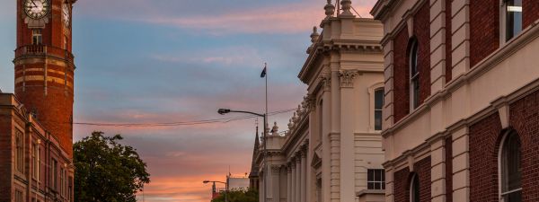 sunset in streets of Launceston, Tasmania behind historic buildings