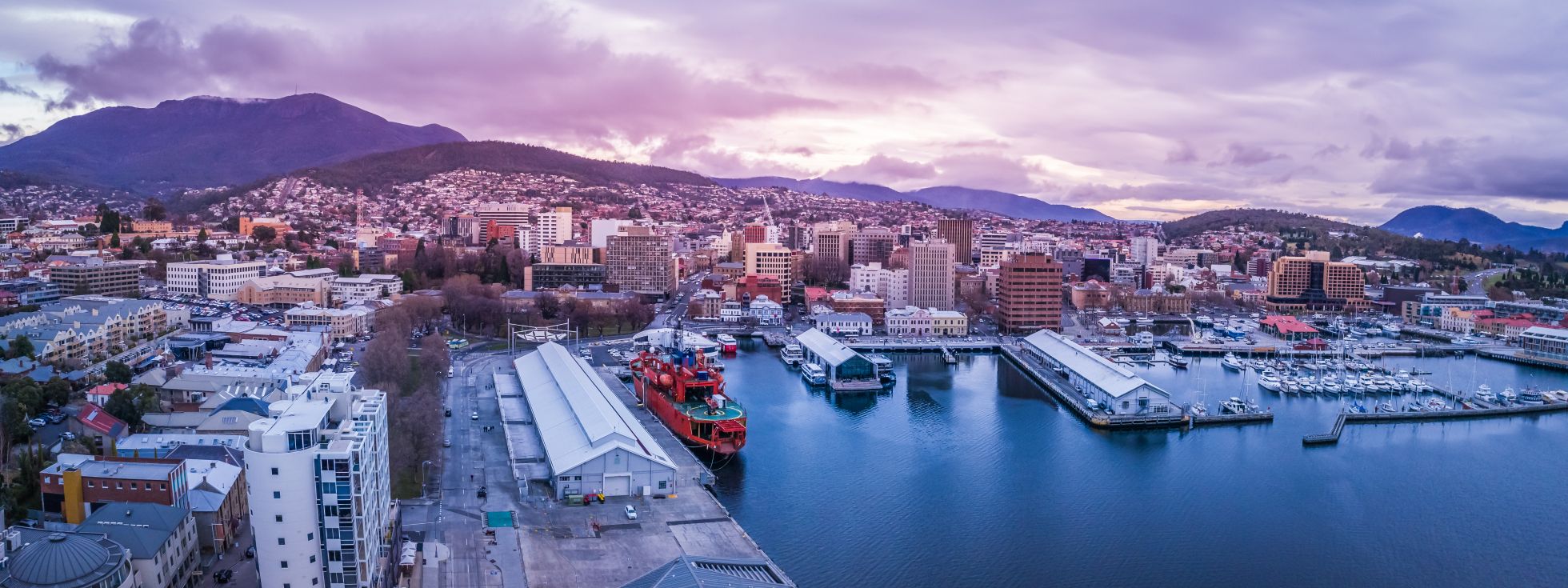 Hobart city marina under sunset sky