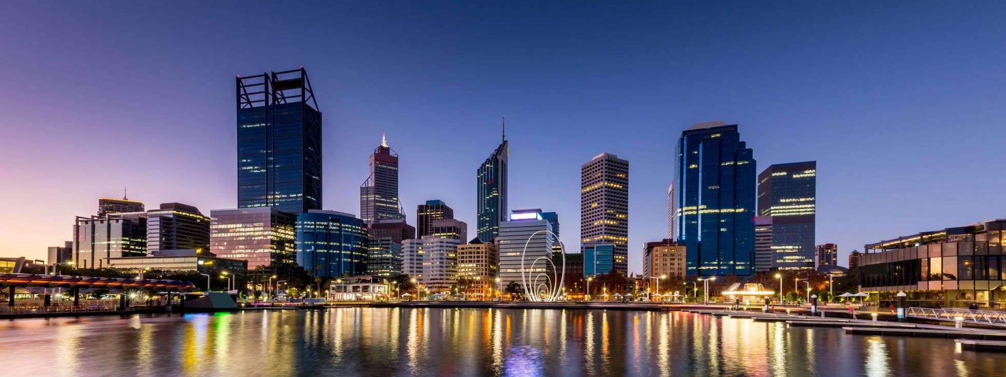 Elizabeth Quay Perth, view of city lit up from Swan river at evening